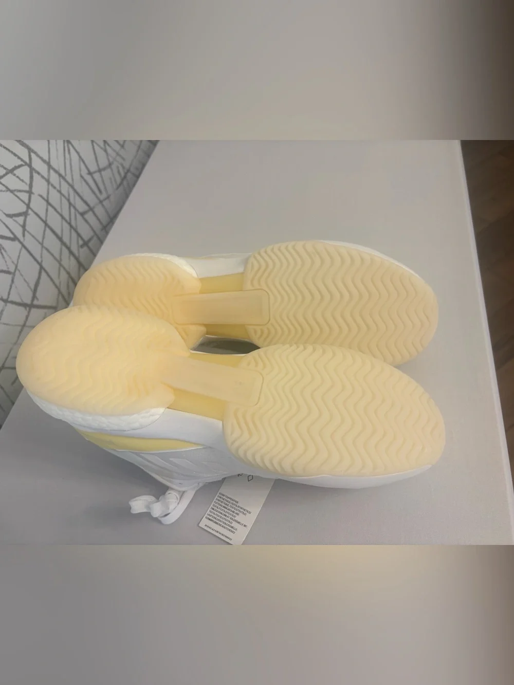 adidas Avaluxe tennis shoes in white with subtle pastel yellow accents. JQ7080